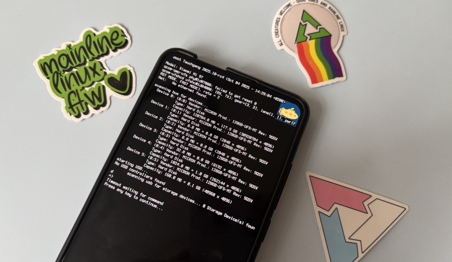 A Xiaomi Mi 9T running Tauchgang, with some postmarketOS stickers around