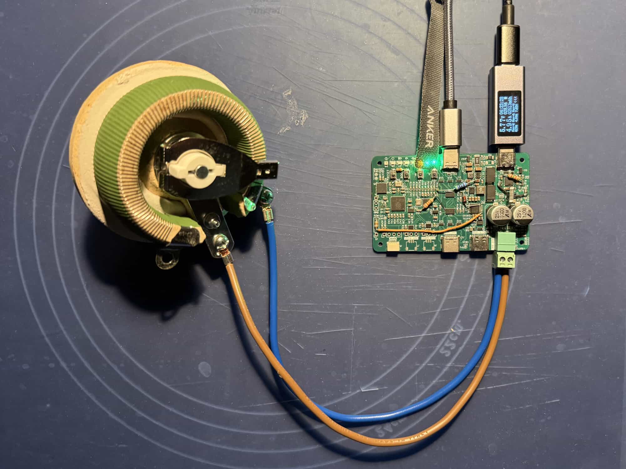 A photo of hand-patched v0.1 PCB connected to a 100W rheostat for 5A load testing